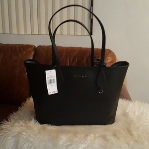 New authentic Michael Kors black purse and pouch .